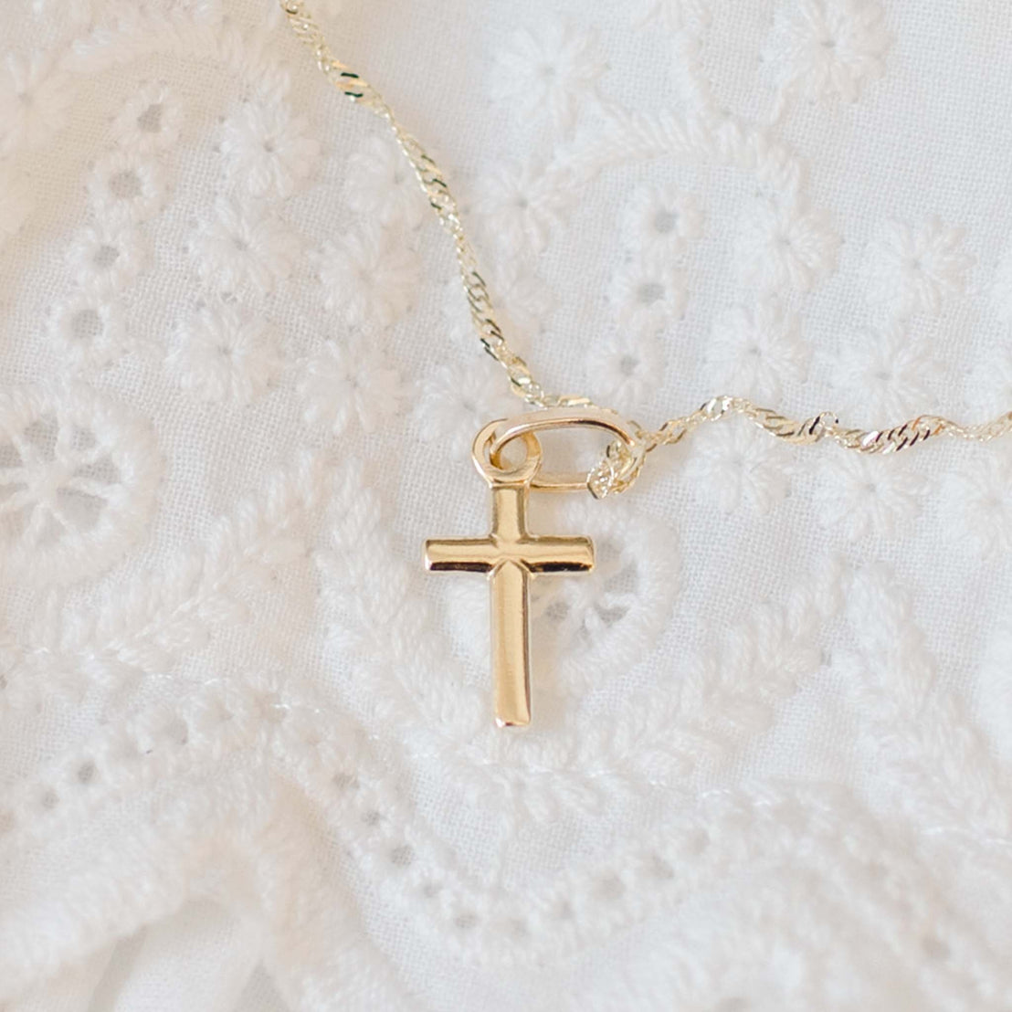 Tiny gold cross charm on chain with lace