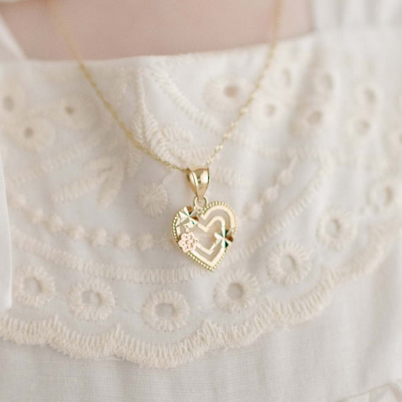 Gold heart with gold flower and rose gold flower detail on baby