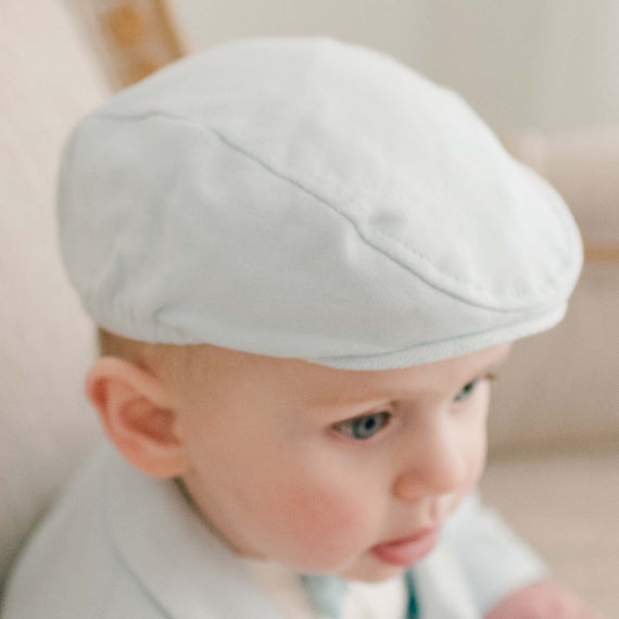 Baby boy in robin's egg blue newsboy cap
