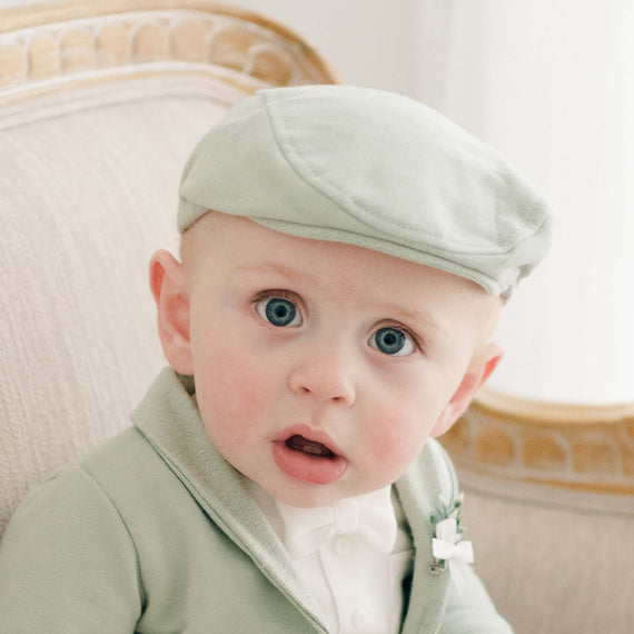 Baby boy in sage green cotton newsboy cap