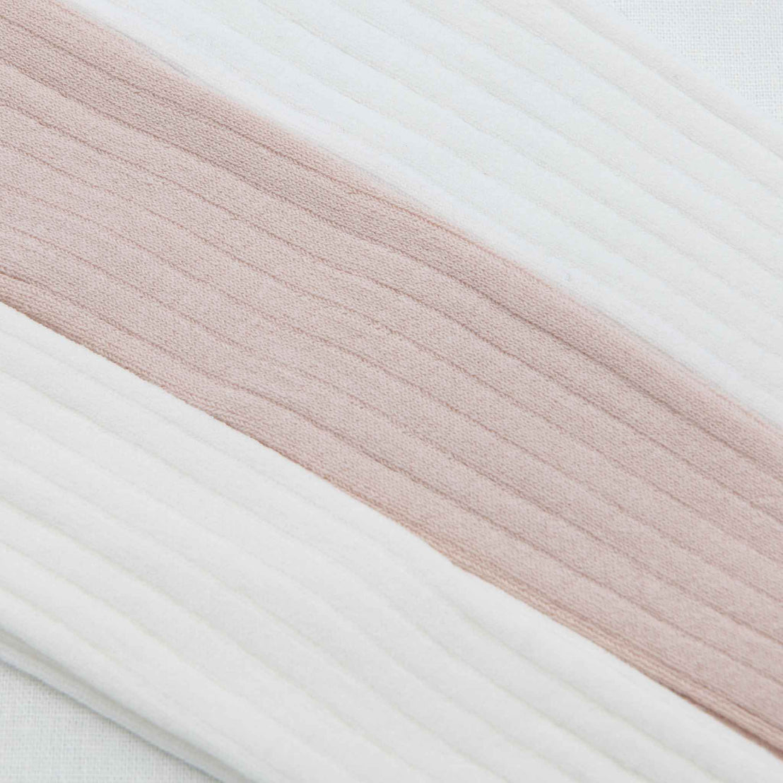 Close-up of various textured tights in the weave and stitching.