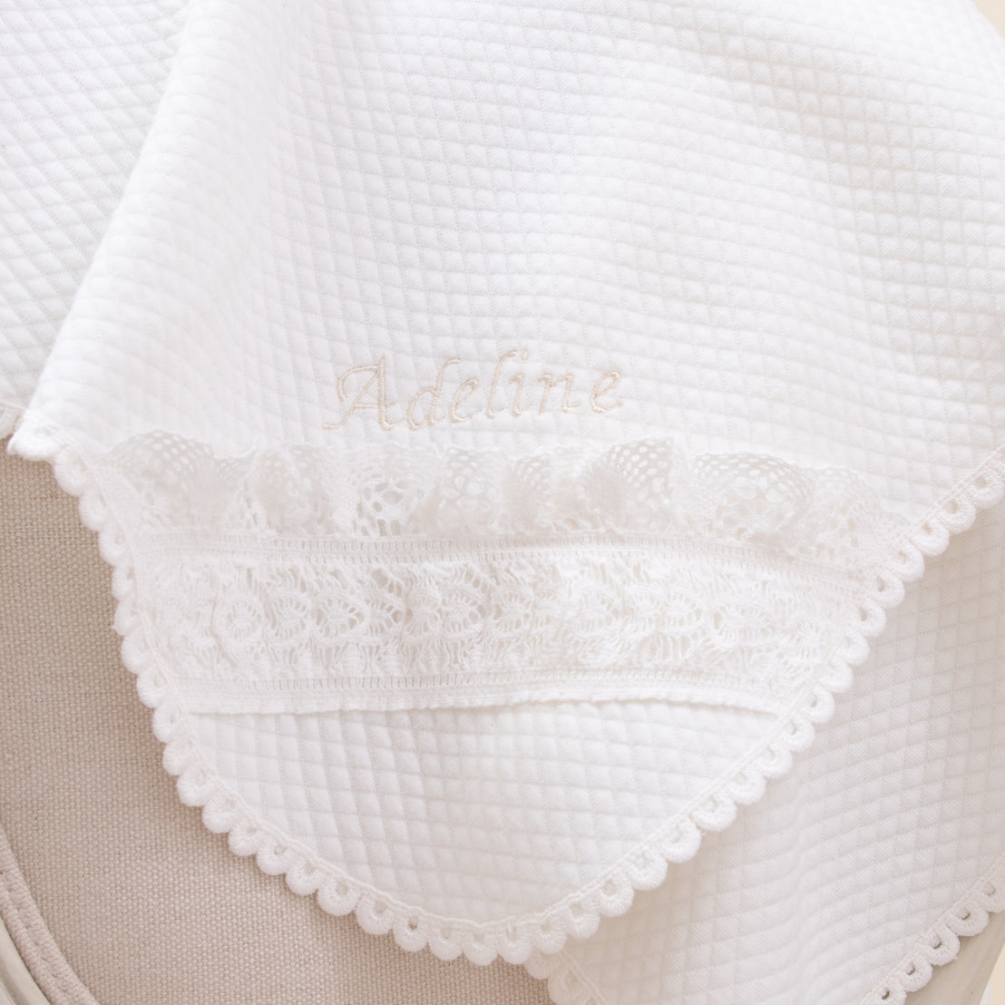 Alternate photo of the Adeline baptism blanket, with name personally embroidered in corner.