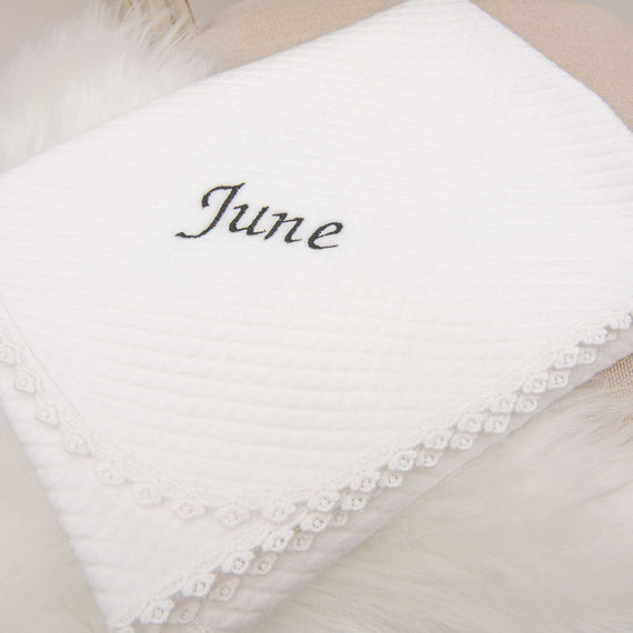 White June Personalized Blanket adorned with a lace trim on a soft, textured cotton background.