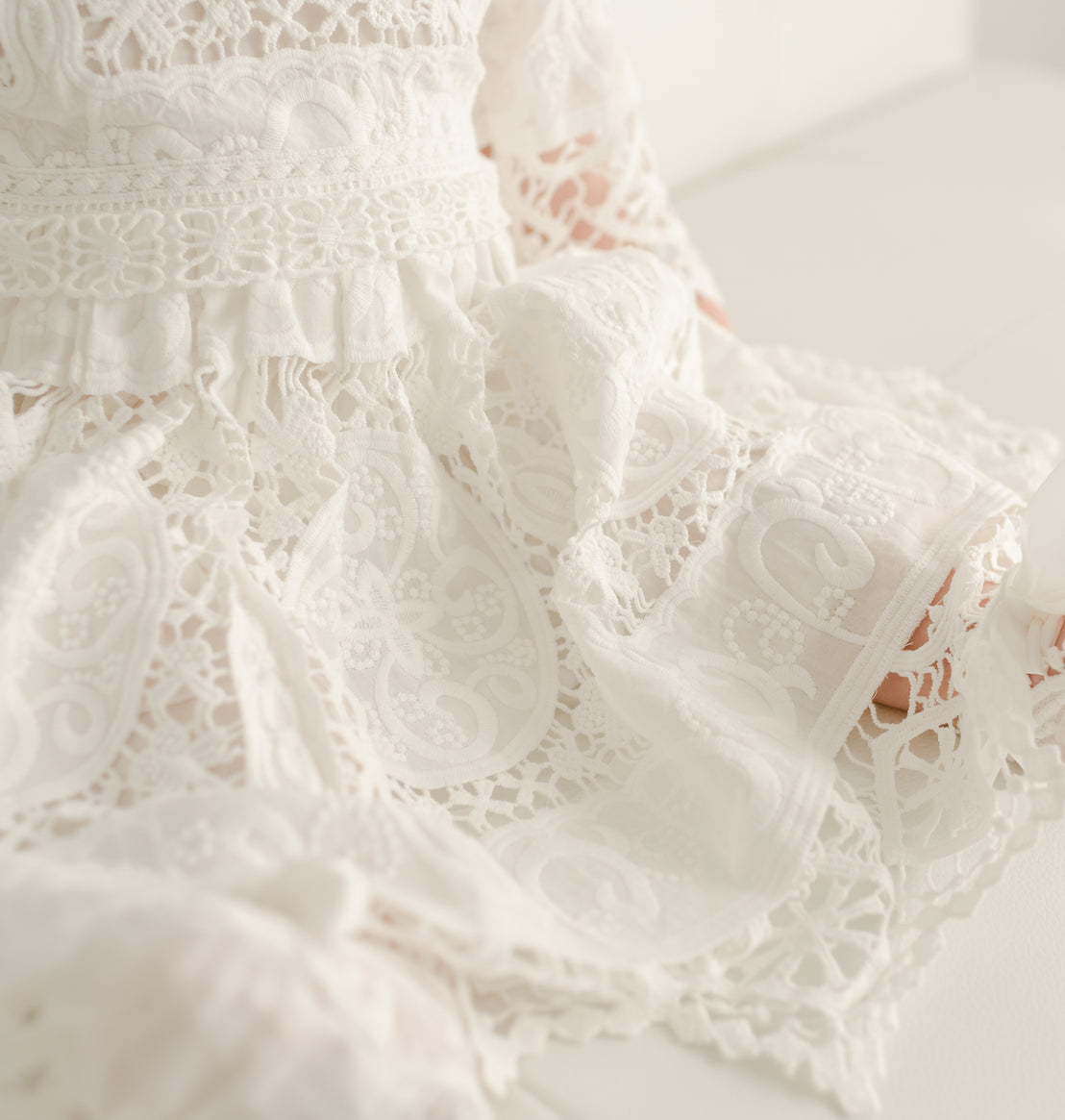 Close up details of the cotton embroidery on the Adeline Lace Christening Dress. 
