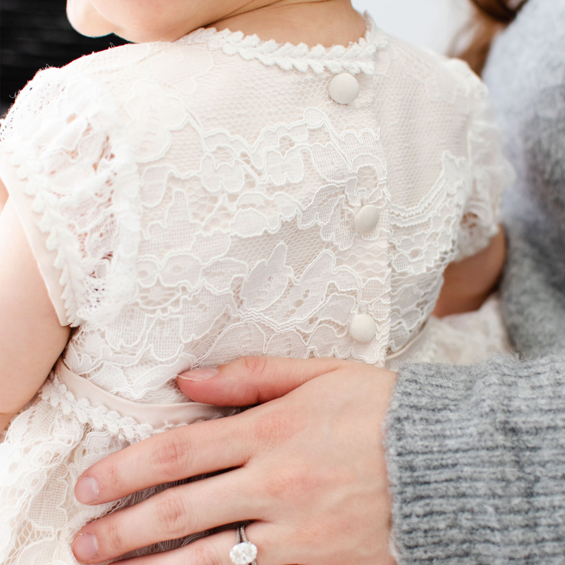 Close up detail of the lace on the back of the Victoria Christening Gown. 