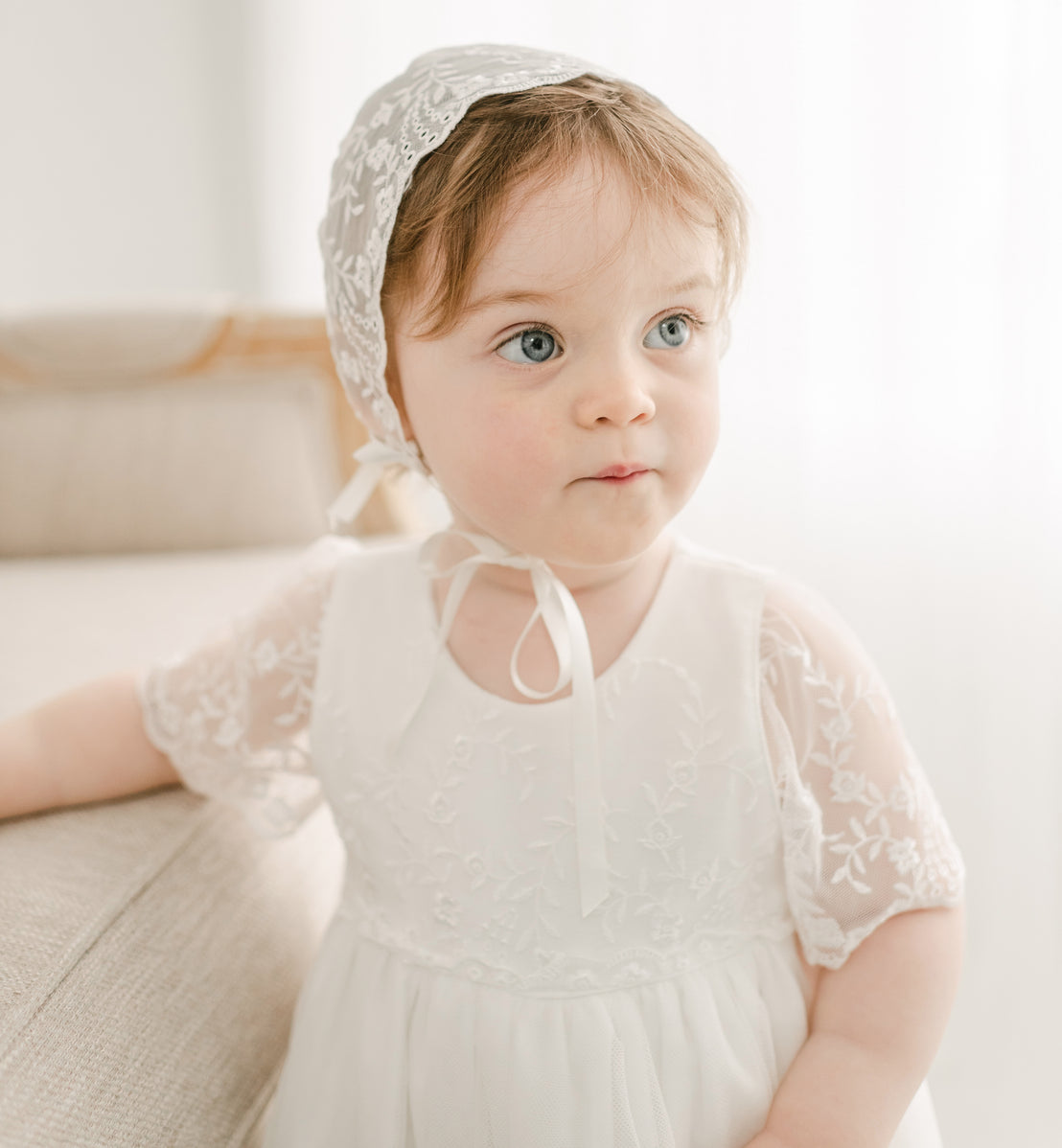 baby girl wearing Ella lace bonnet 