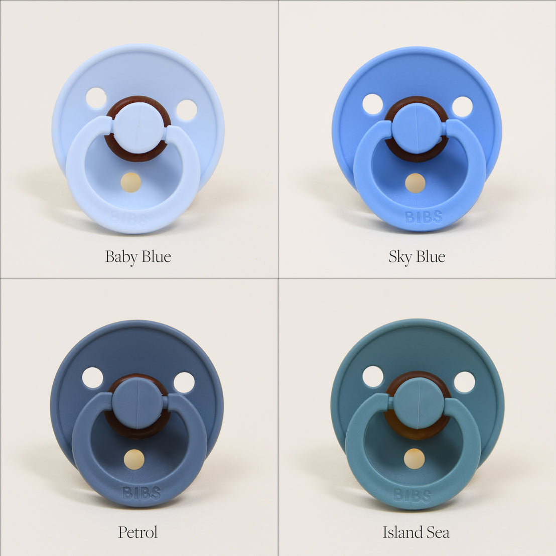 Four Bibs Pacifiers in shades of blue labeled baby blue, sky blue, petrol, and island sea, each against a matching pastel blue background.
