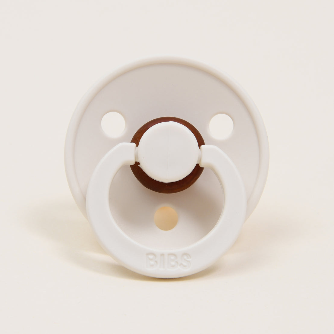 Photo of an ivory colored pacifier