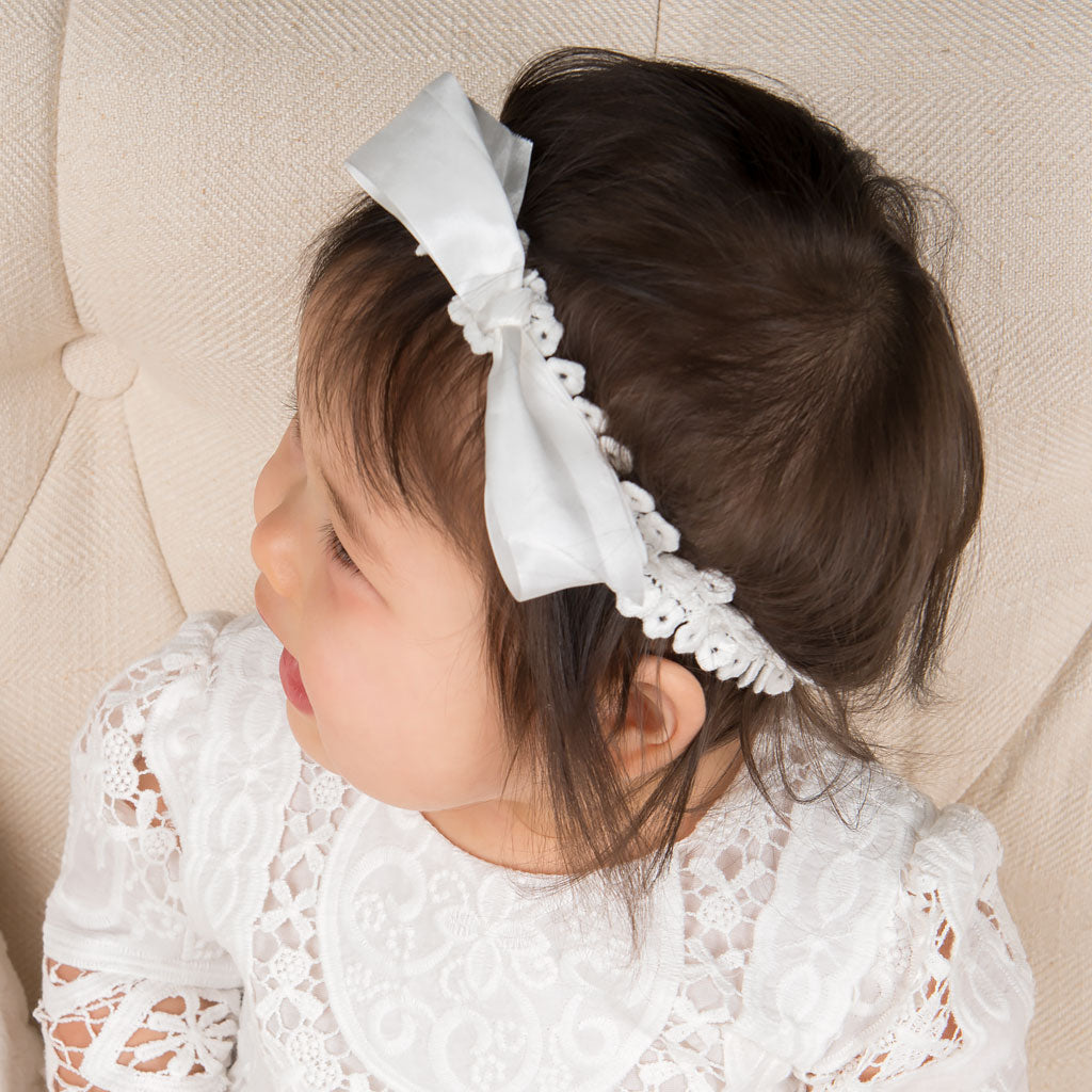 Baby profile photo: Wearing the Adeline headband in cotton with bow.