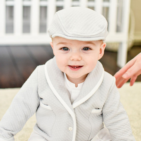 Asher newsboy hat on a smiling baby boy.