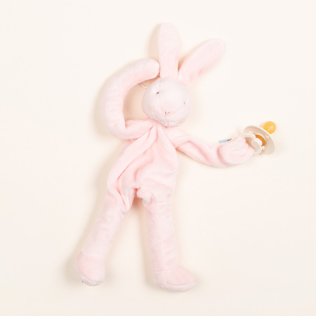 A Silly Bunny Buddy pacifier holder with long ears, displayed on a plain light background, perfect for a christening.