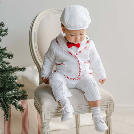 boy sitting in chair wearing the nicholas baby christmas outfit