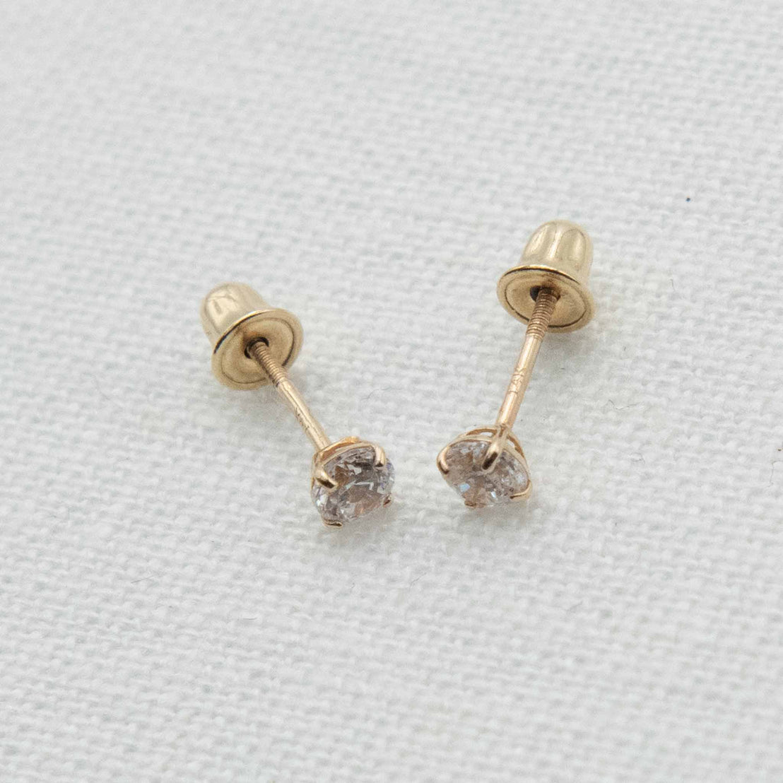 Gold stud earrings with clear stones