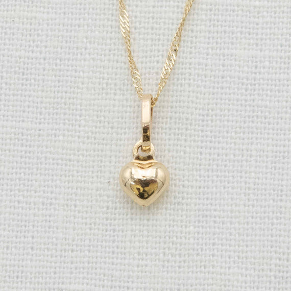 Small gold heart charm necklace