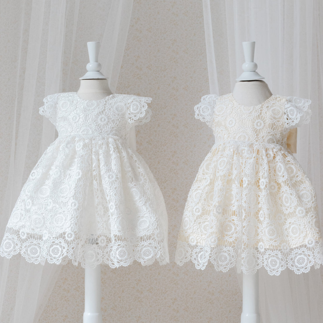 Poppy lace dress silk color options on mannequins against a neutral background