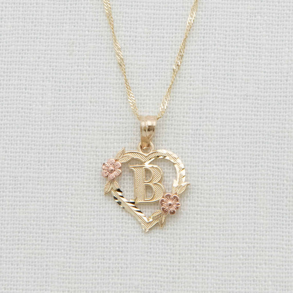 Gold heart charm necklace with initial