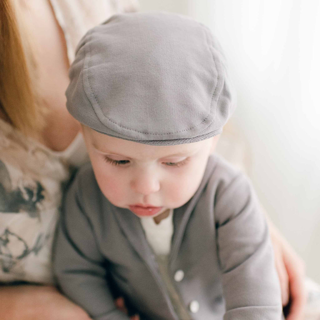 Baby boy in grey cotton newsboy cap Milo