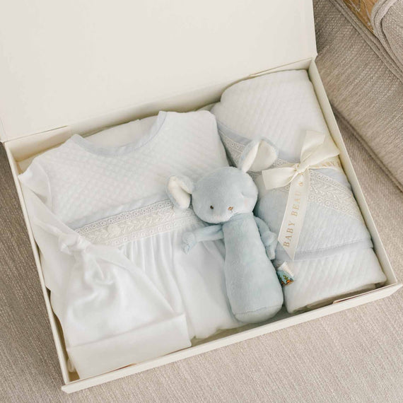 Photo of the Harrison Newborn Gift Set, which includes the Layette Gown, Bonnet (or Knot Cap), Rattle, Blanket, and Gift Box.