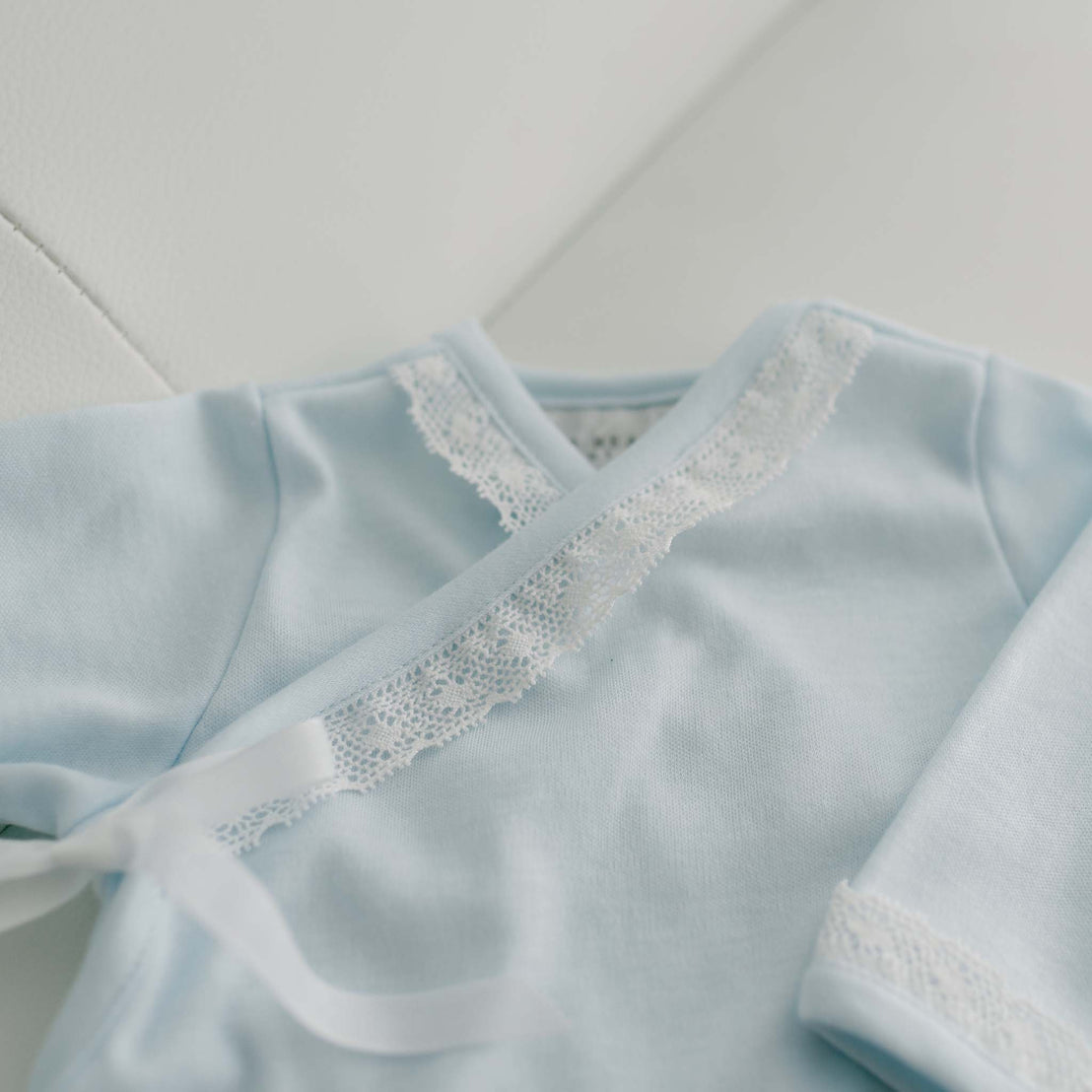 Lace detail on blue cotton baby gown