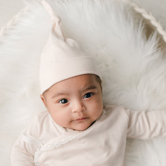 Baby girl wearing pink cotton knot cap