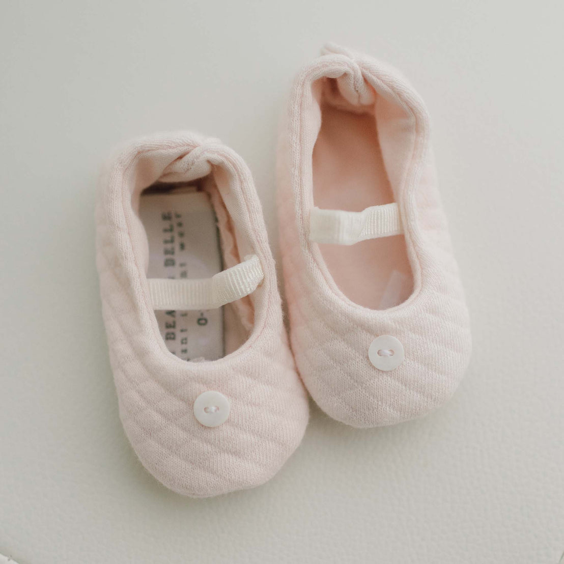 Pair of pink baby girl booties