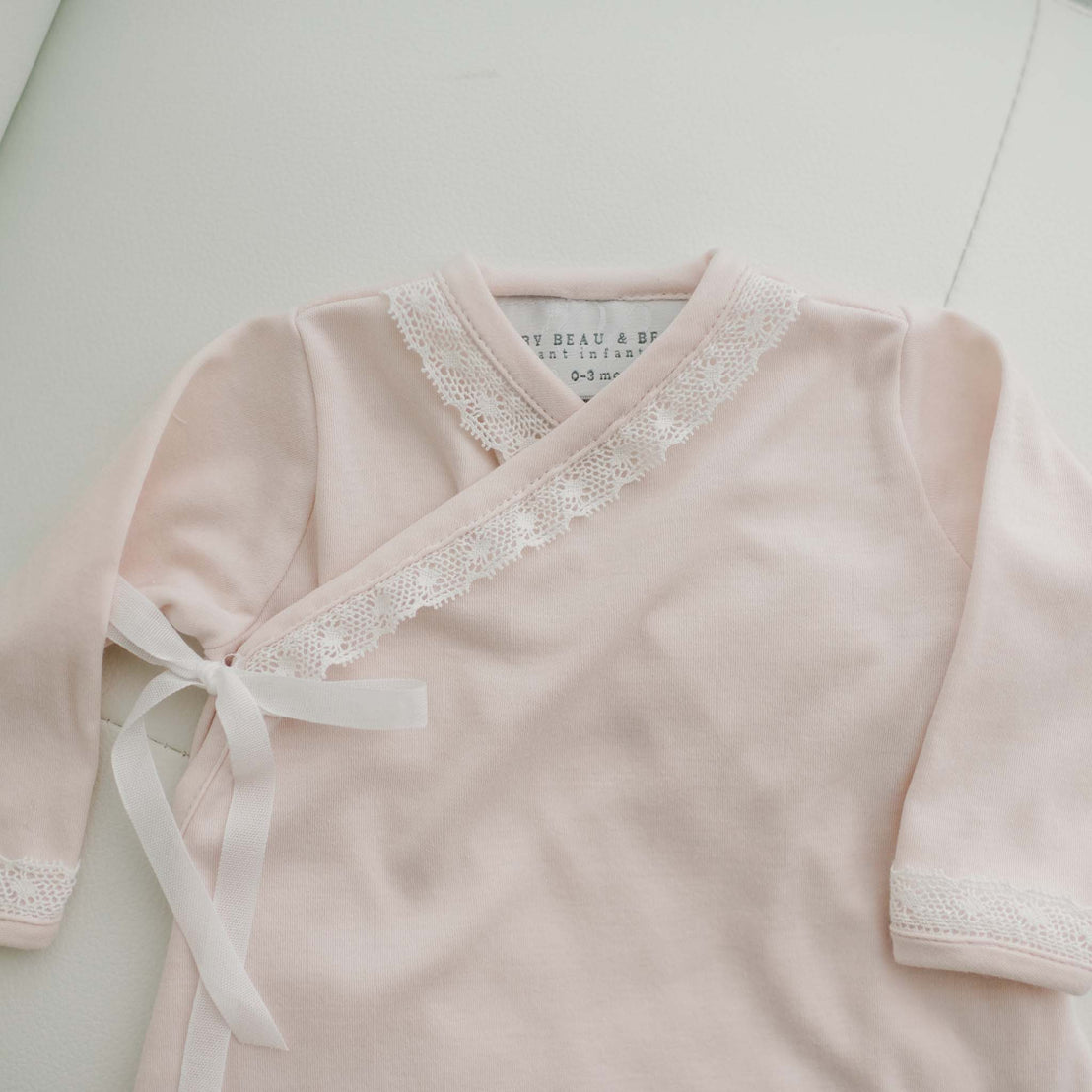 Lace detail on pink baby girl layette gown