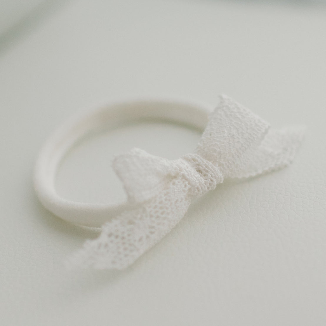 Cotton lace bow headband on hand-stretched nylon band