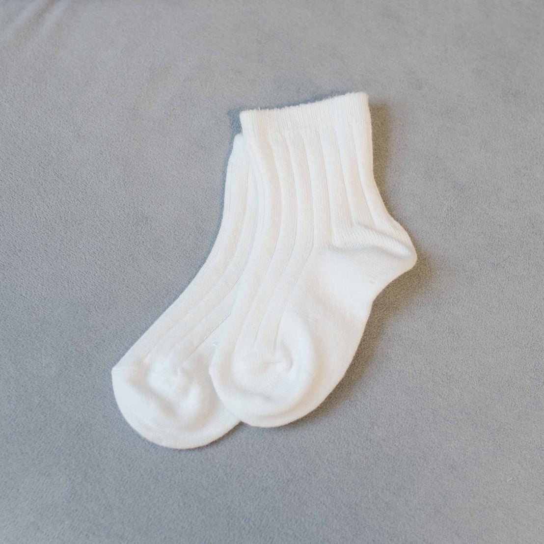 Flat lay photo of the short length Cream Ribbed Socks