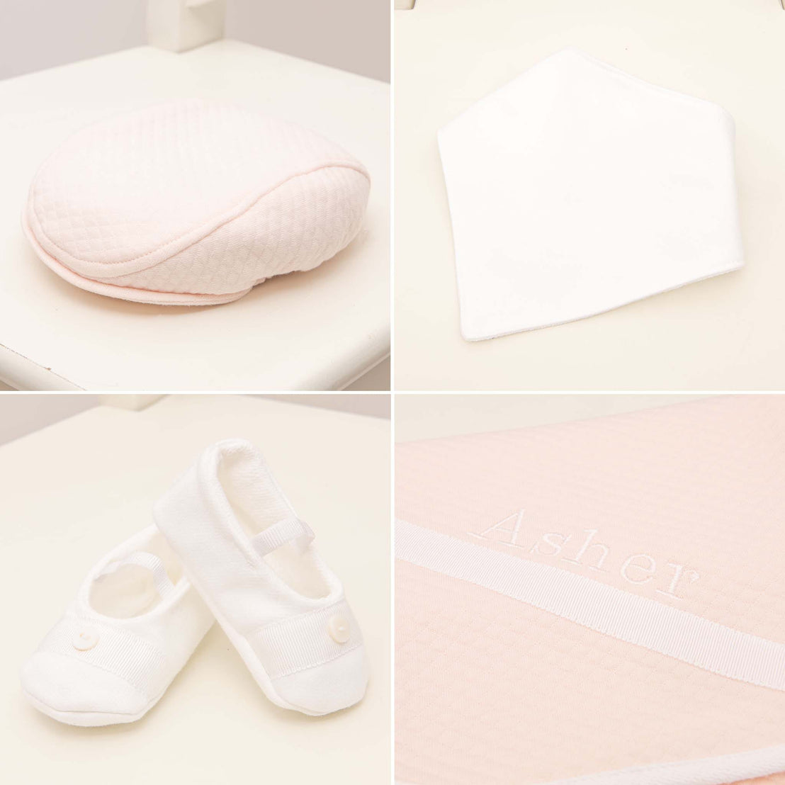 A delightful set of pastel pink and white baby essentials, featuring a quilted baby cap, soft bib, tiny booties, and the standout Asher Blush personalized quilted blanket with "Asher" beautifully embroidered on it—all artistically arranged on a pristine white background. Part of the Asher Blush Suit Accessory Bundle that offers a 15% savings.
