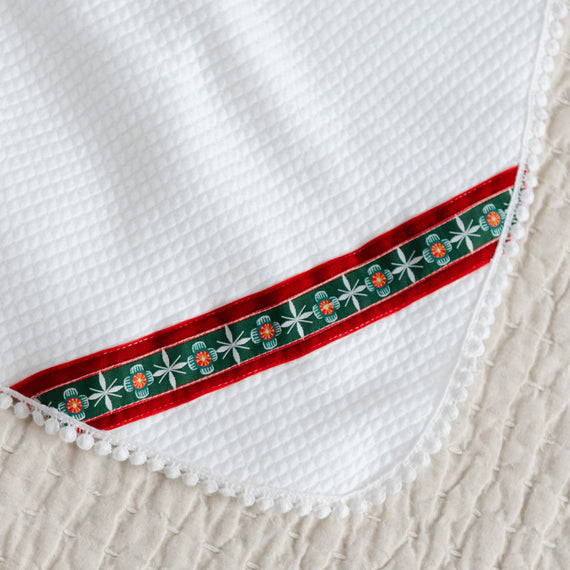 White blanket with velvet and pattern ribbon detail with lace trim