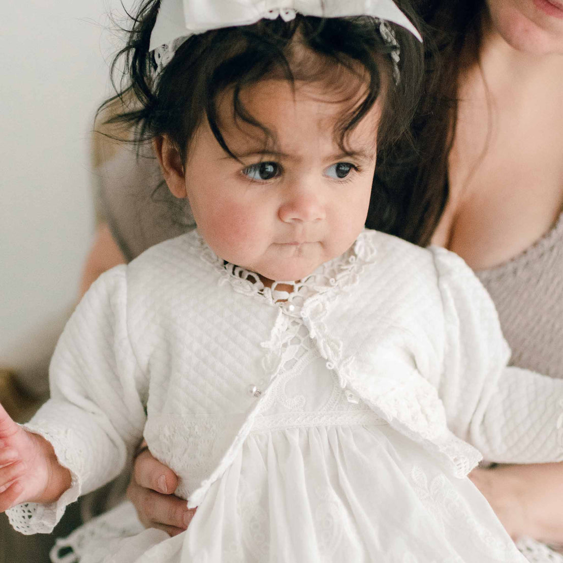 Baby wearing a Lily Quilted Cotton Sweater