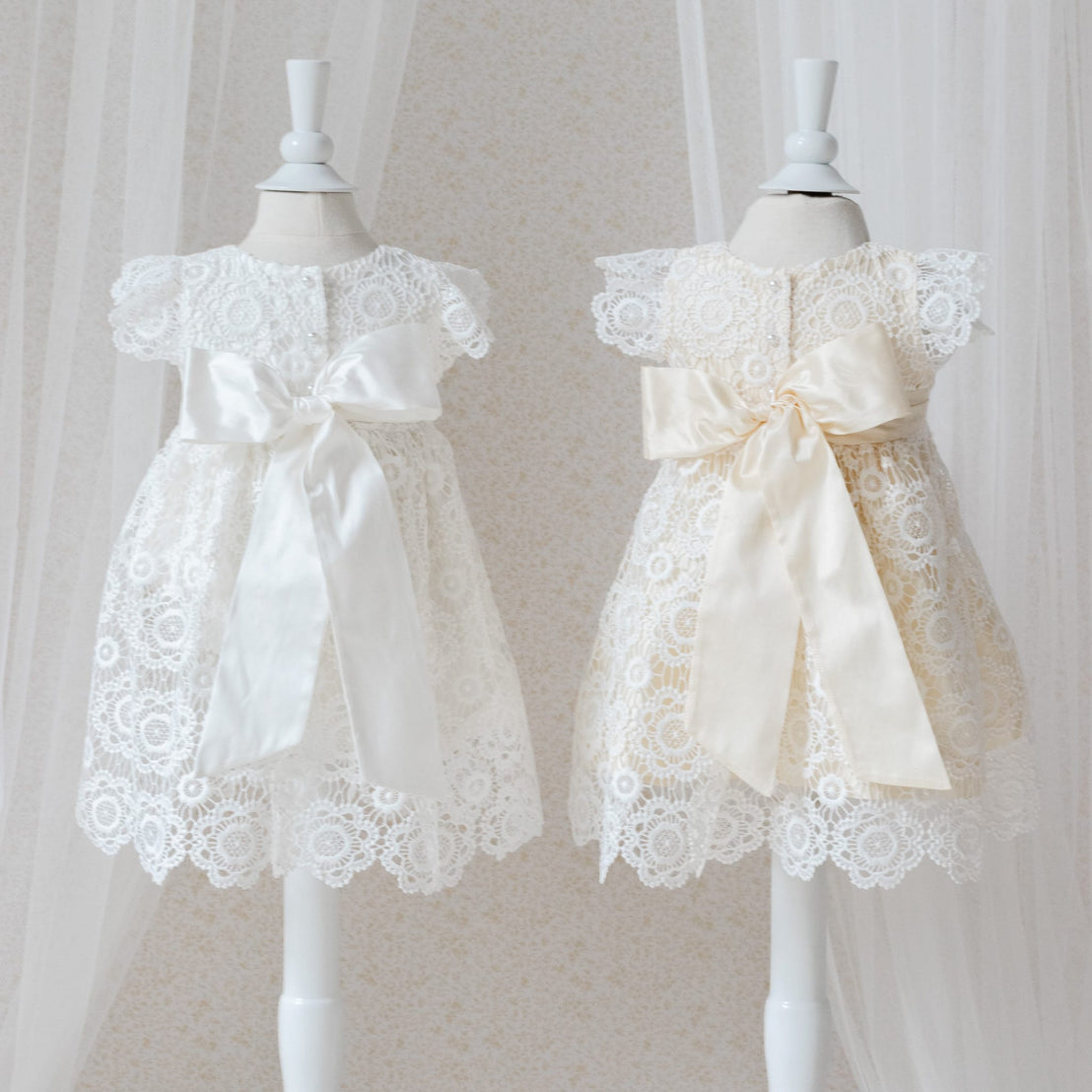 Poppy lace dress back silk color options on mannequins against a neutral background
