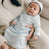 Baby with Mom, wearing blue pima newborn gown and quilted cotton bonnet