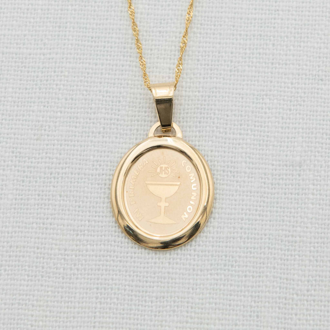 Solid gold charm with cup and quote engraving on chain