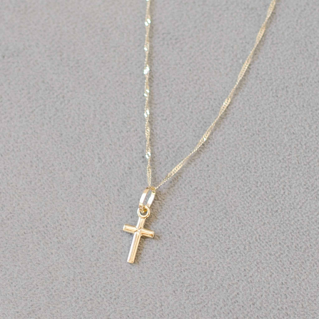 Small cross charm on chain