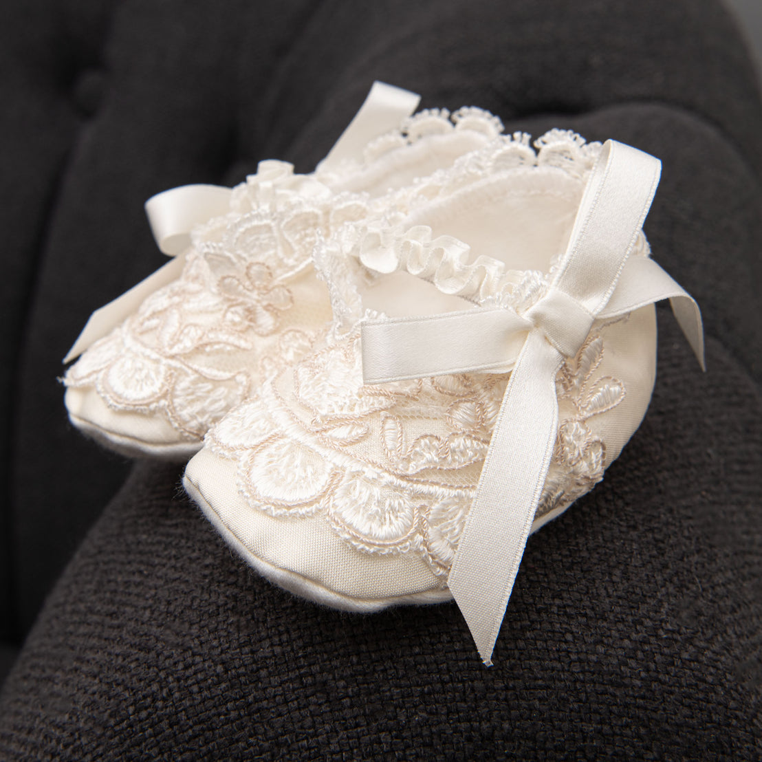 Close up photo of the Penelope christening booties.