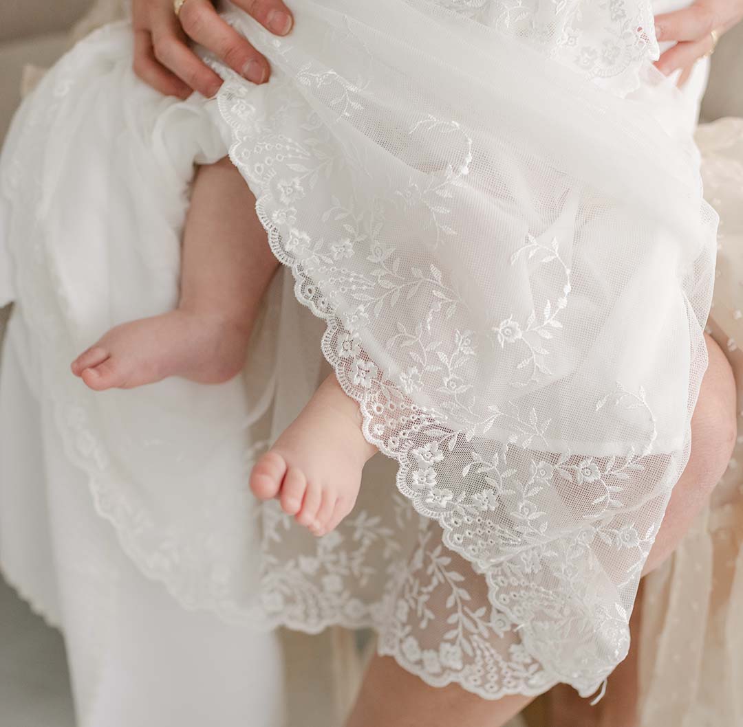 closeup of the lace on the Ella christening gown
