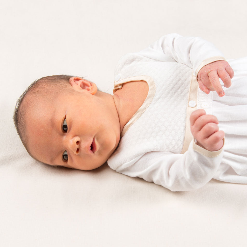 Close up detail of newborn baby wearing the Liam Cotton Newborn Gown