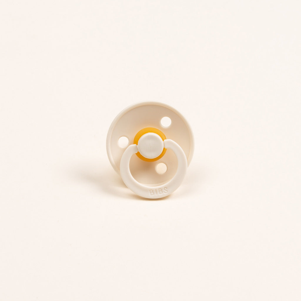 Photo of an ivory colored pacifier