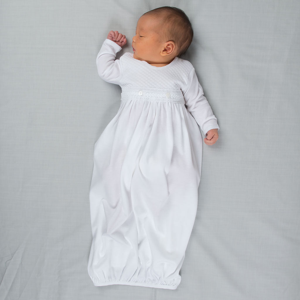 Photo of baby sleeping and wearing the Elijah Newborn Gown
