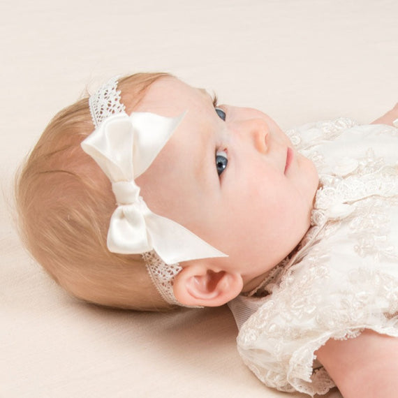 Baby girl wearing lace headband. 