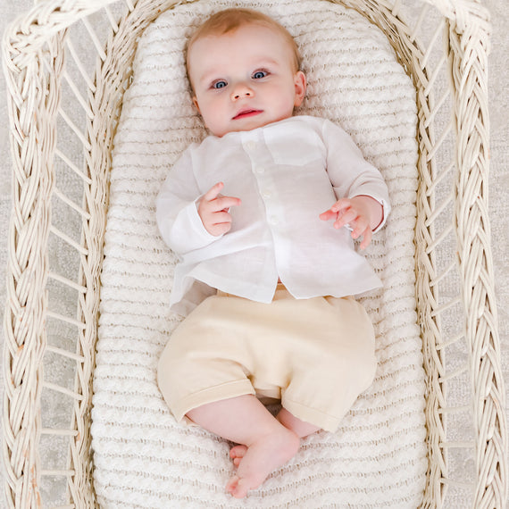 Baby boy in a crib wearing the Silas White Linen Shirt 