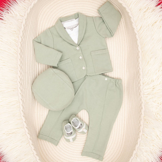 Flat lay Milo sage green suit and accessories in basket