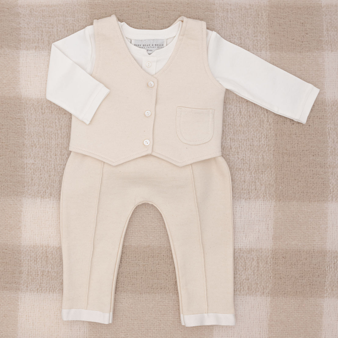 Flat lay photo of the Braden Vest Pants Suit, including the vest, pants, and onesie