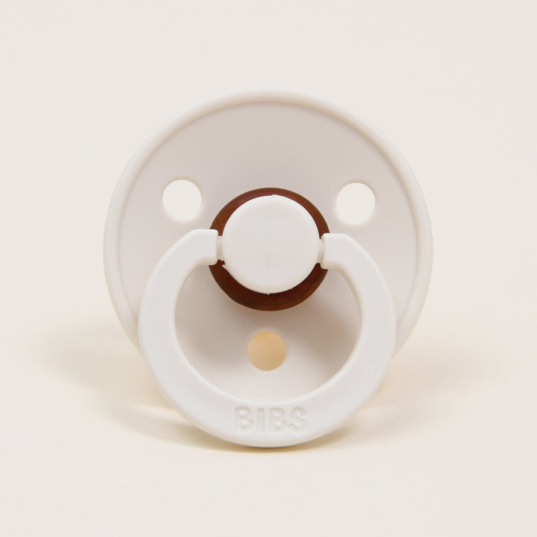 A Bibs pacifier in "ivory" set against a white background.
