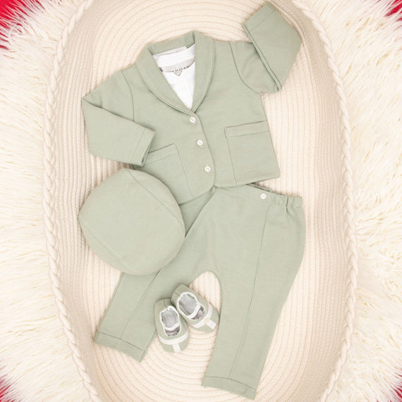 Flat lay Milo sage green suit and accessories in basket
