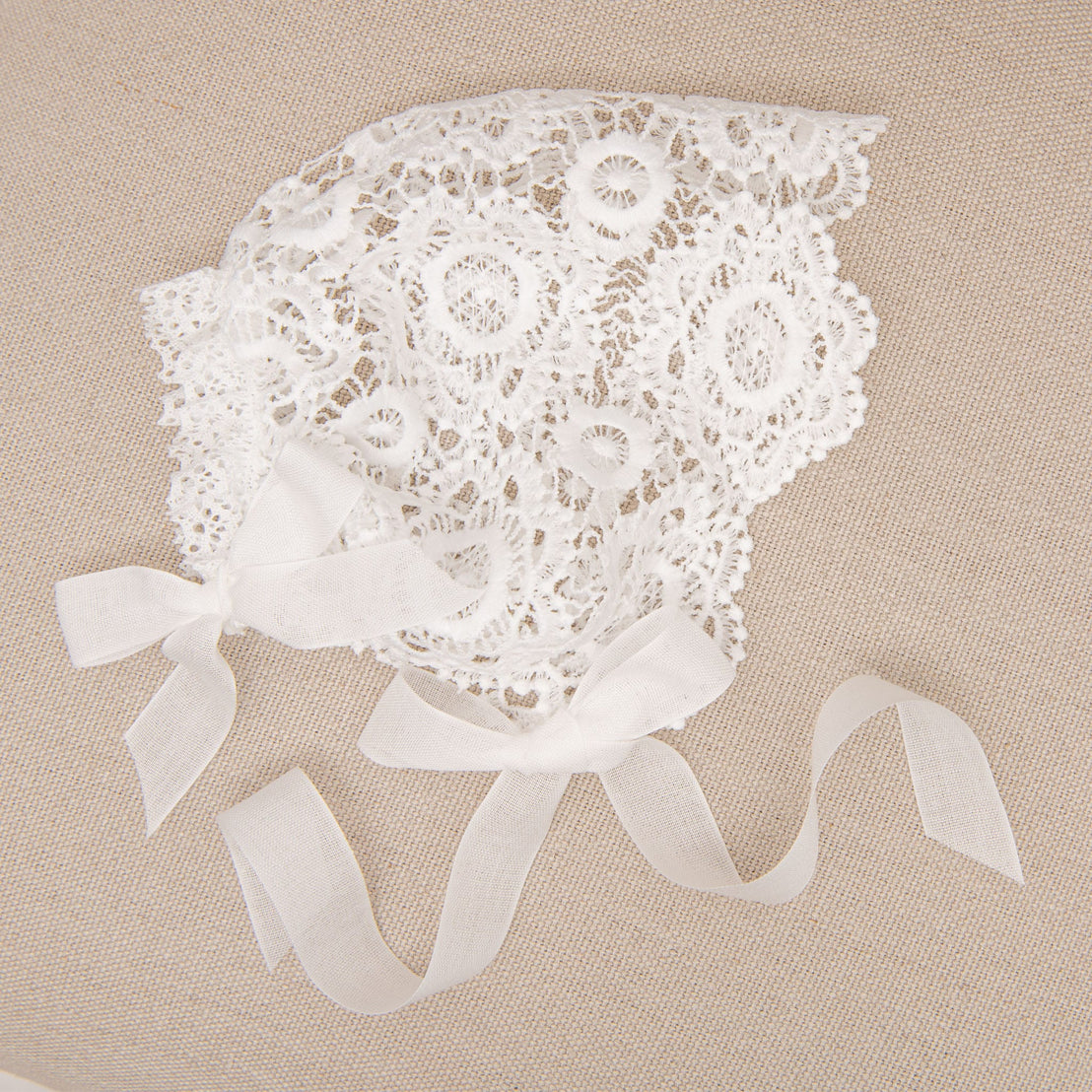 Closeup photo of the Poppy christening bonnet. 