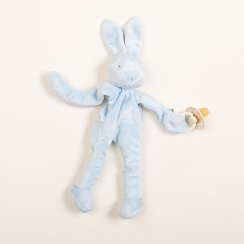 A Blue Silly Bunny Buddy pacifier holder with long floppy ears and limbs, ideal as an upscale baby gift, displayed on a light beige background.